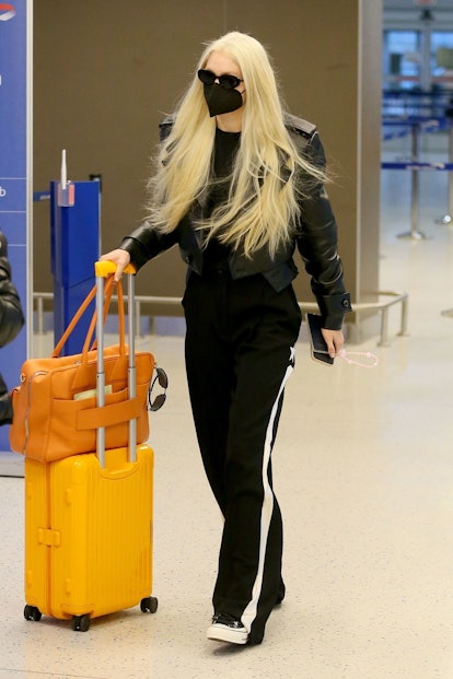 Gigi Hadid platinum bleach blonde airport hair