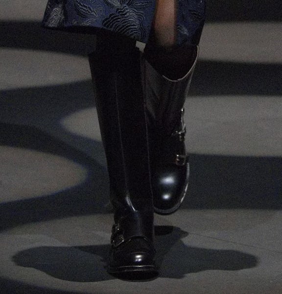 a model wearing black leather moto boots on the Erdem runway