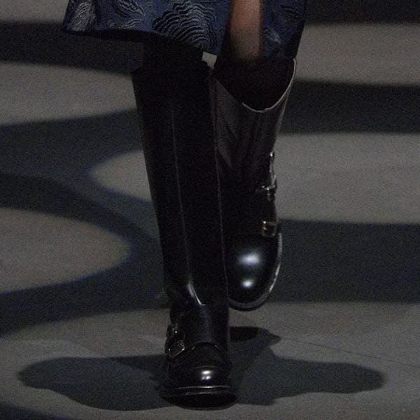 a model wearing black leather moto boots on the Erdem runway