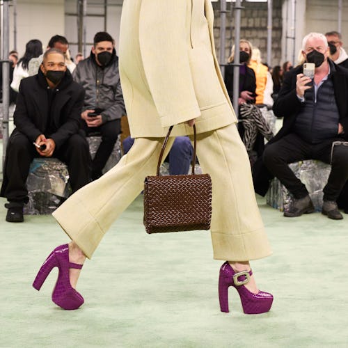 a model wearing purple croc-embossed platform mary jane heels on the Bottega Veneta runway