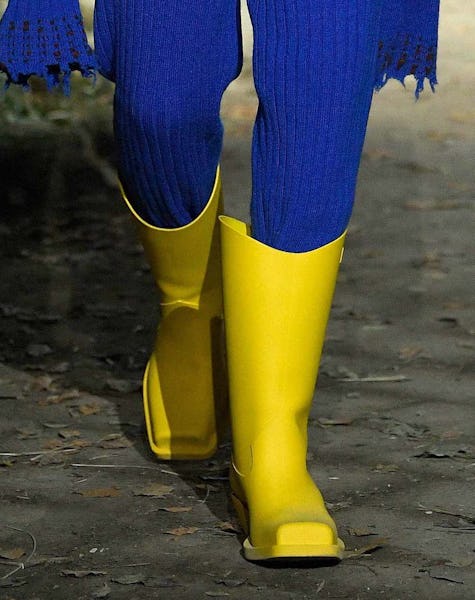 a model wearing yellow rain boots on the Marni runway