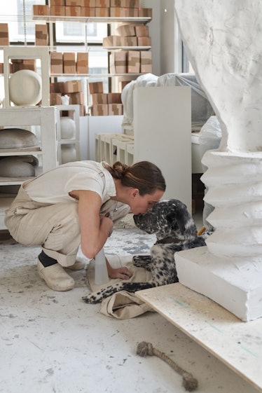 Simone Bodmer-Turner and her dog in the studio