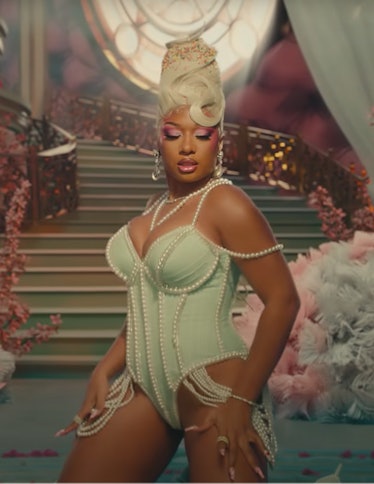 Megan Thee Stallion wearing a white beehive topped off with sprinkles in the Sweetest Pie video