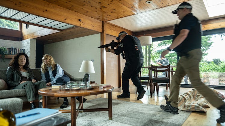 A law enforcement official pointing a gun at Villanelle in Killing Eve season 4 episode 3