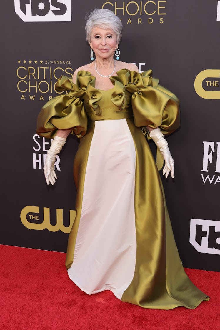 Rita Moreno wearing an olive green and ivory gown at the Critics Choice Awards 2022