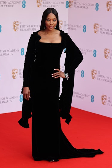 Naomi Campbell attends the BAFTA Awards in a black dress