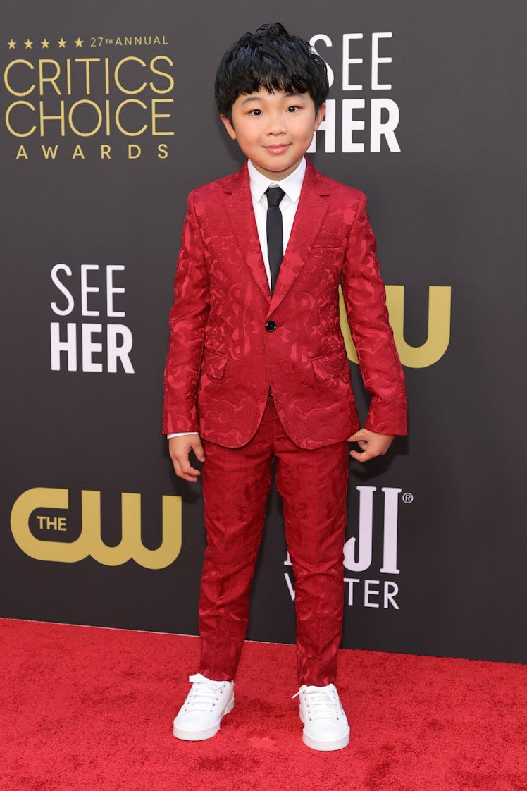 Alan Kim in a red suit at the Critics Choice Awards 2022