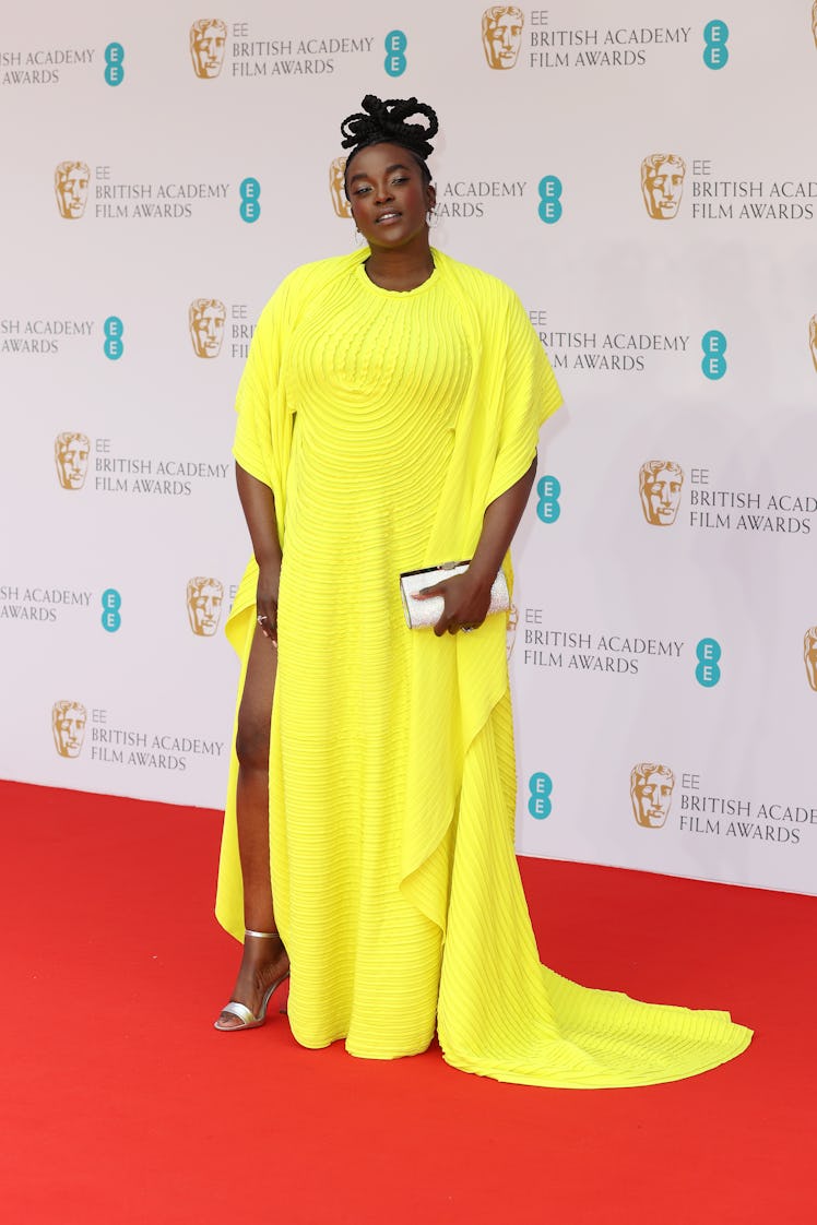 Wunmi Mosaku wearing a yellow Marc Jacobs dress at the BAFTA Awards 2022