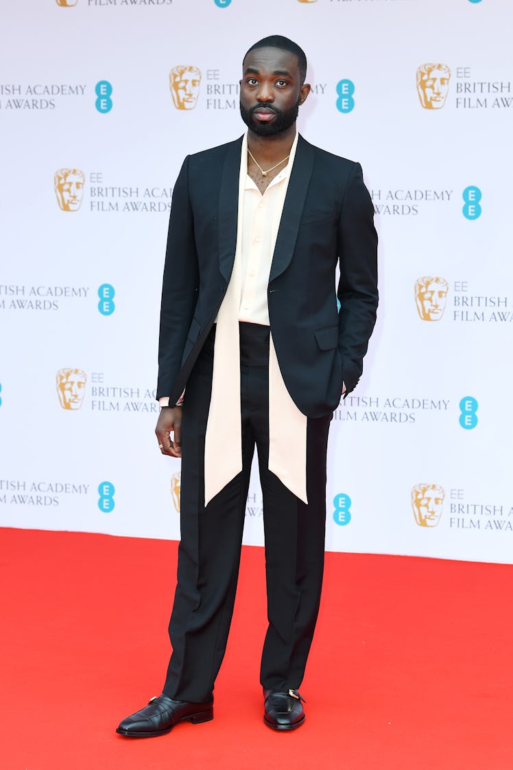 Paapa Essiedu wearing a suit at the BAFTA Awards 2022