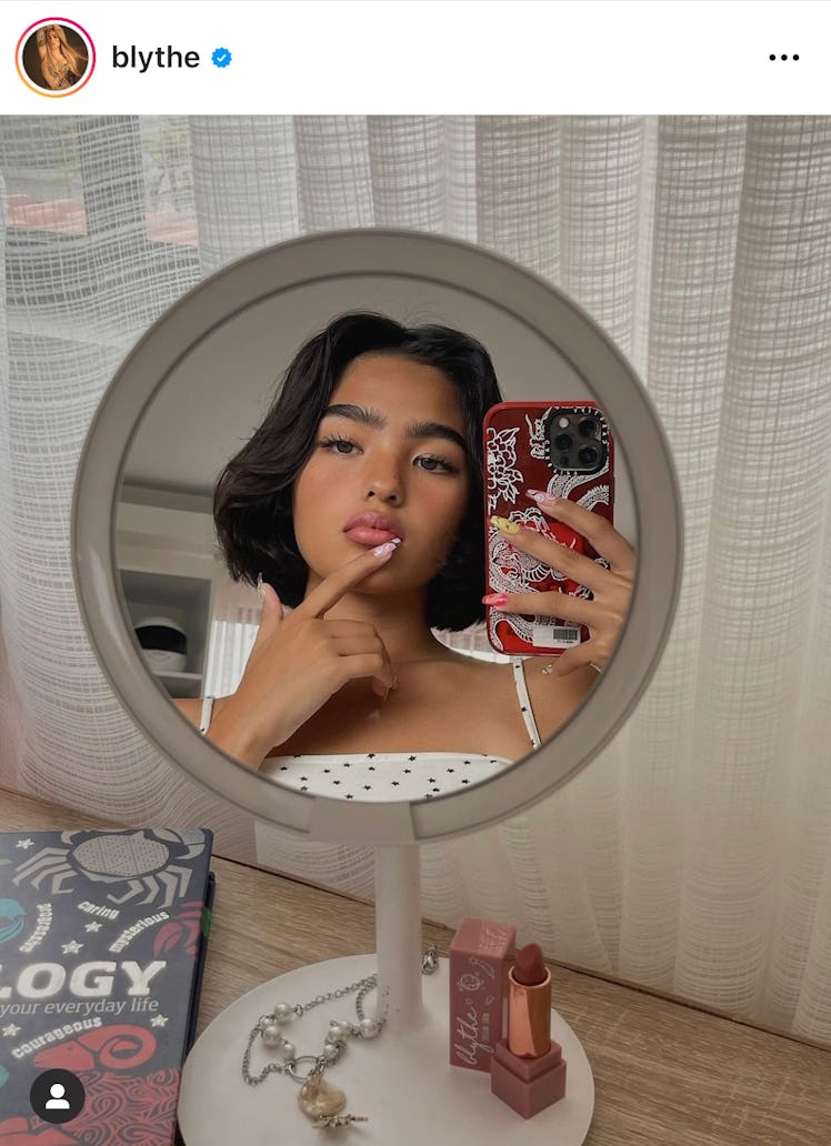 Fashion influencer Blythe is a pro at the small mirror selfie Instagram pose. 