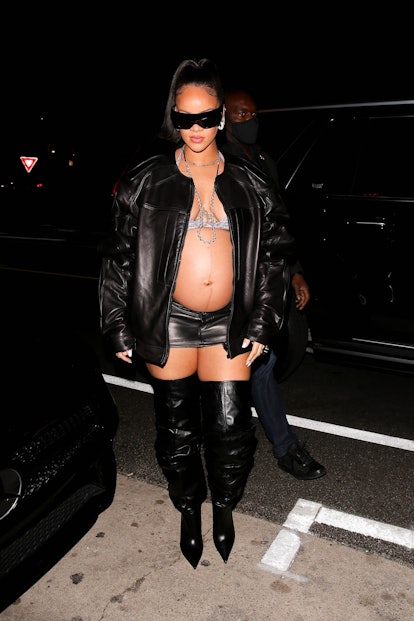 Rihanna shows off her burgeoning baby bump as she leaves Giorgio Baldi restaurant after having dinne...