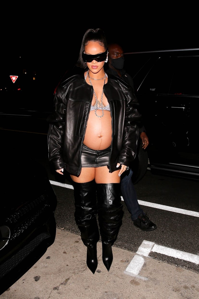 Rihanna shows off her burgeoning baby bump as she leaves Giorgio Baldi restaurant after having dinne...