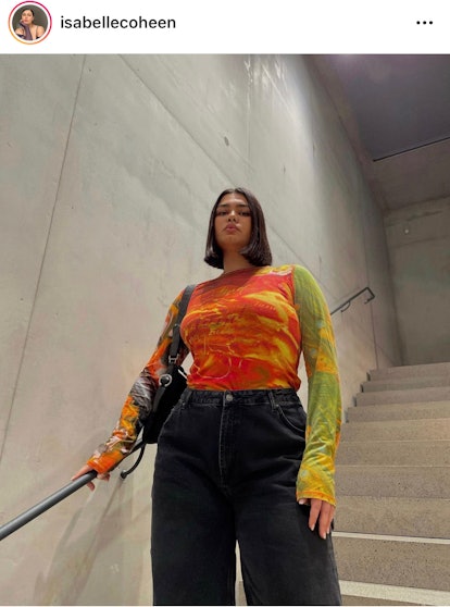 Isabelle Coheen strikes the stairwell pose, which is an aesthetic pose.