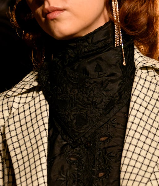 a model wearing rhinestone fringe earrings on the Markarian runway