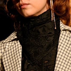 a model wearing rhinestone fringe earrings on the Markarian runway
