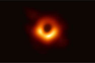 first image of black hole M87, with a firey, donut shaped ring surrounding a black area