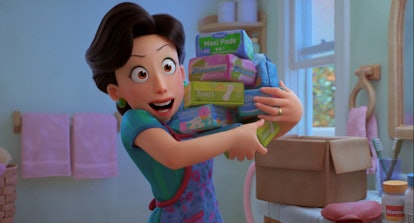 Ming holding an armful of menstrual products