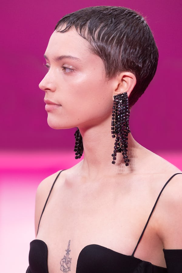 a model black fringe rhinestone earrings on the Valentino runway