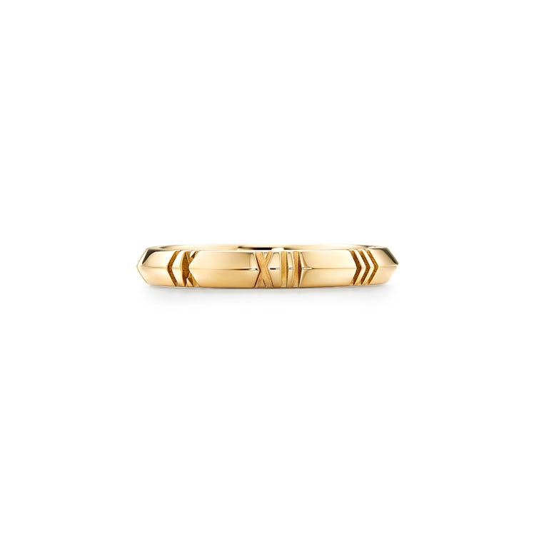 a yellow gold knife-edge ring with Roman numerals 