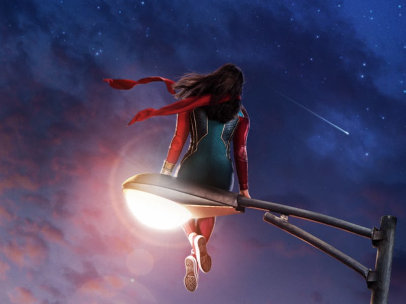 Iman Velanni sitting on the street light as Ms. Marvel