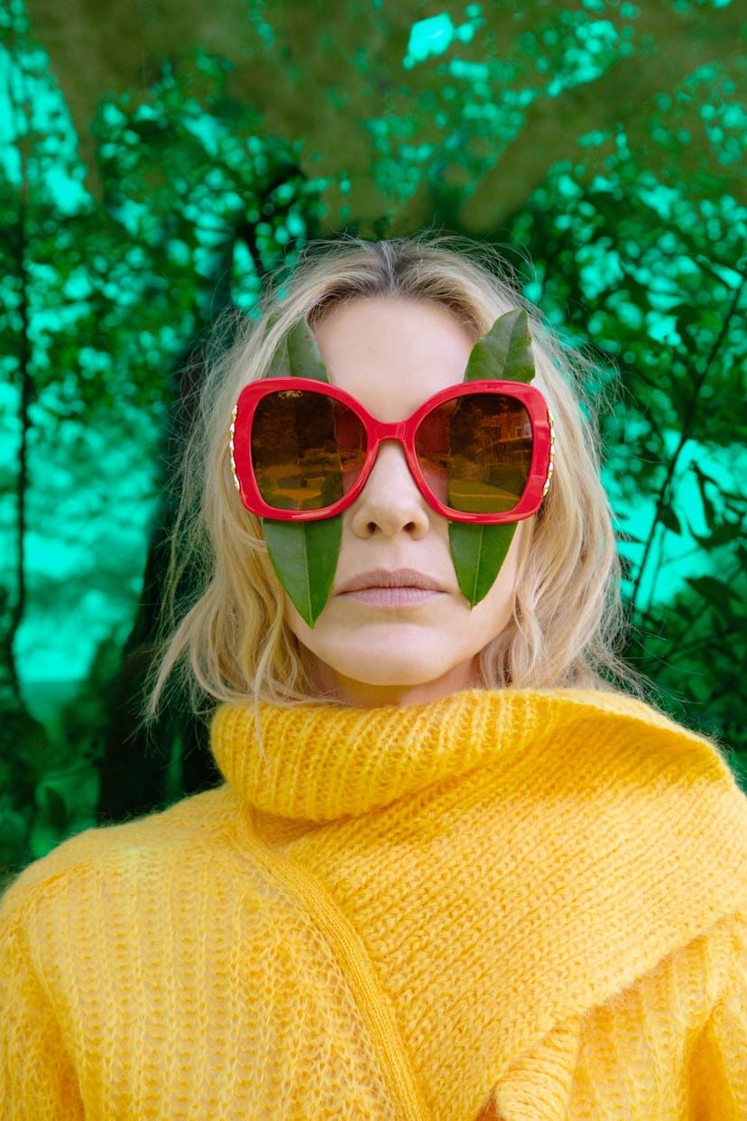 Cate Blanchett posing with two leaves under her sunglasses