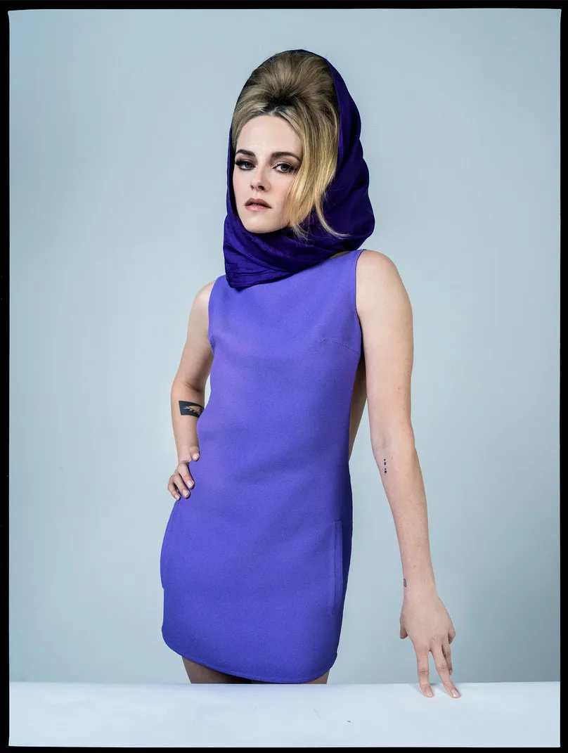 Kristen Stewart wearing a purple dress and scarf