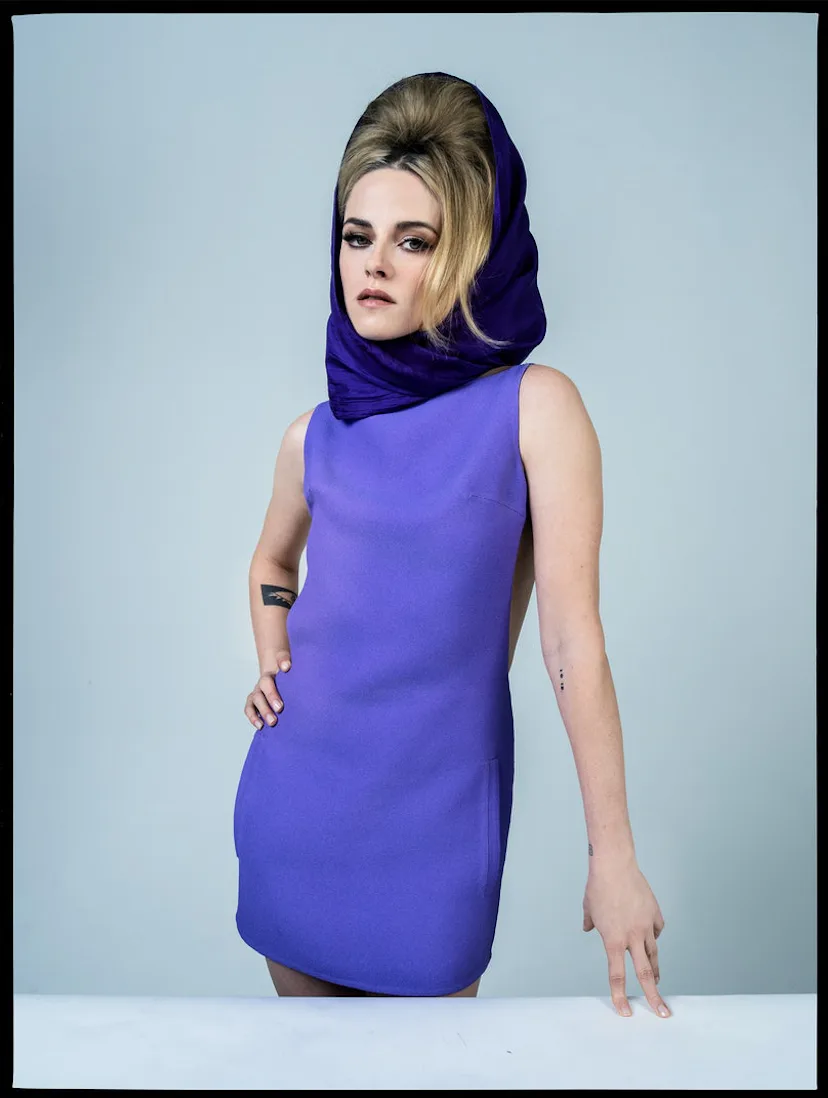 Kristen Stewart wearing a purple dress and scarf