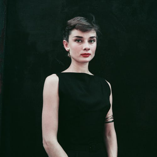 Audrey Hepburn in a black sleeveless dress circa 1955. 