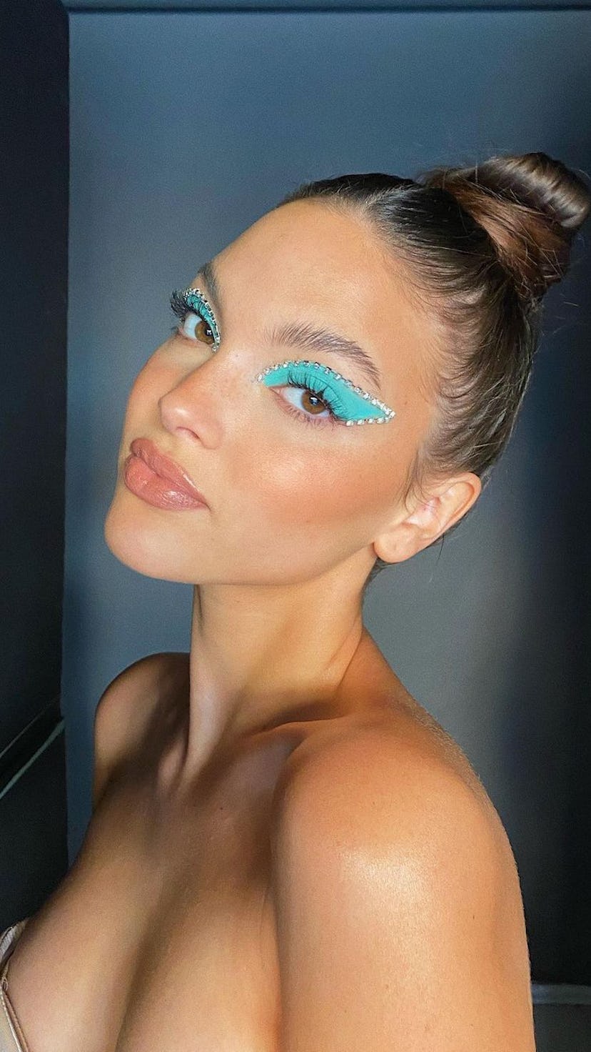TikToker Kensnation in turquoise eyeshadow with crystals Euphoria makeup