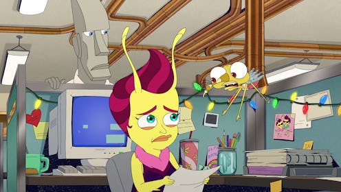 A screengrab of Emmy the Lovebug sitting in a cubicle and looking worried while Pete the Logic Rock ...