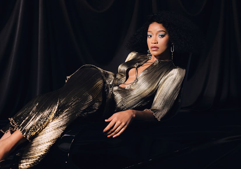 Keke Palmer in a shiny set of Altuzarra top and skirt and Uncommon Matters earrings