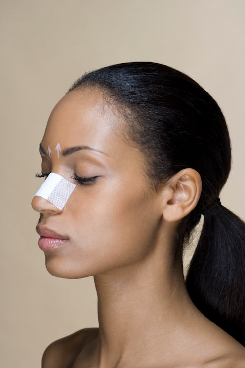 woman with a nose job bandage