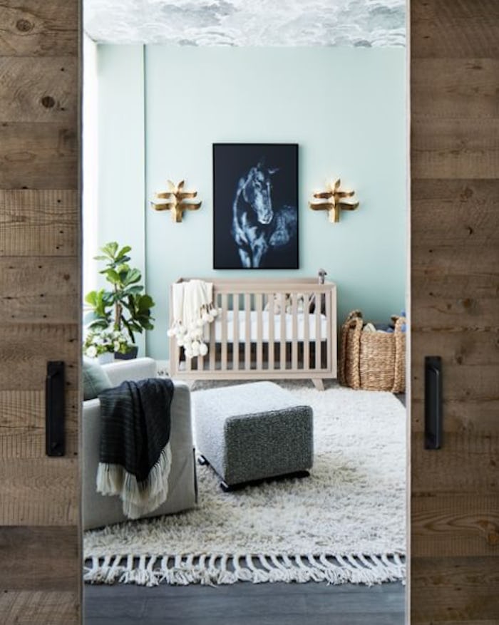 Baby boy nursery idea with a horse image and barn doors