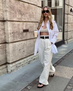 Blonde woman wearing an oversized button-down outfit