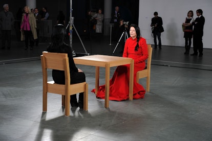 Marina Abramovic in red at museum. 