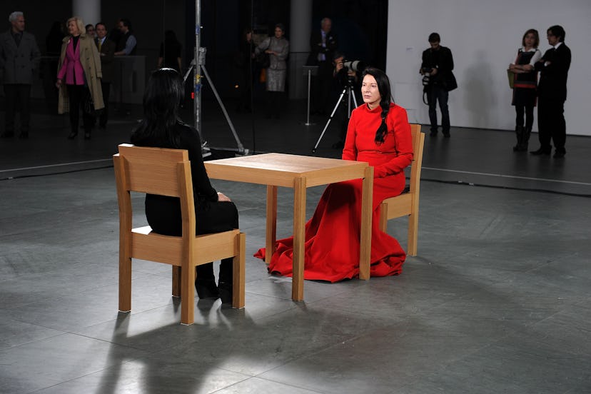 Marina Abramovic in red at museum.