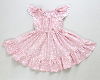 The fluttery sleeves and skirt on this dress will have your little one frolicking to and fro.