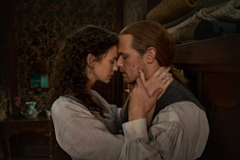 Claire and Jamie in 'Outlander' Season 5. They're facing each other closely and nearly kissing.