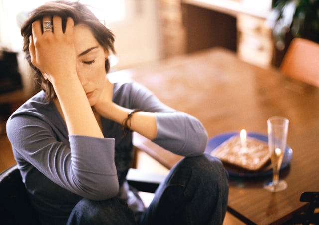 Woman wearing a gray shirt annoyed by hearing people say that everything happens for a reason