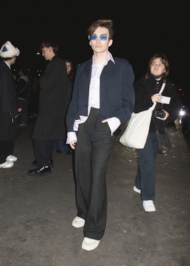 A person wearing blue-tinted glasses at Paris Fashion Week