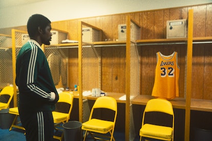 Quincy Isaiah as Magic Johnson staring at his jersey in 'Winning Time'