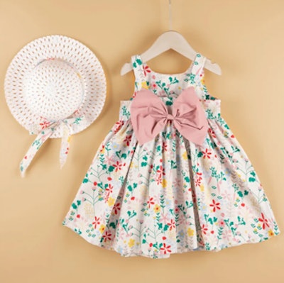 Your little girl will look like she belongs on a book cover in this spring dress and straw hat.