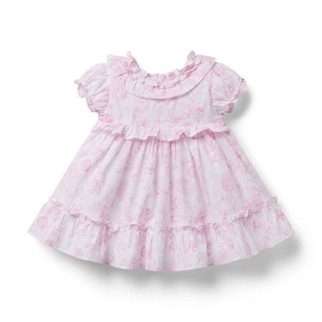 This frilly Easter dress has a pink bunny pattern all over.