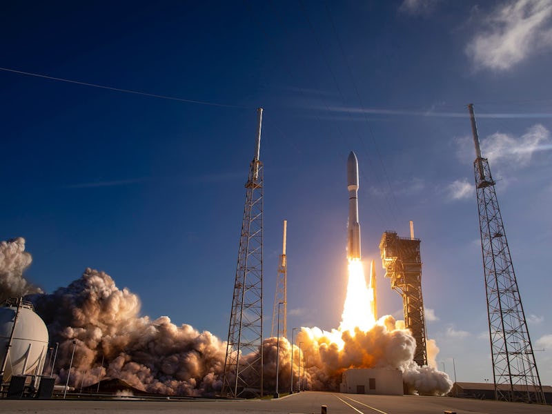 An Atlas V rocket blasting off.