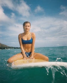 Hailey Bieber wearing a blue bikini. 