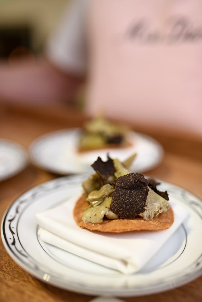Artichoke truffle tostadas and a mini grilled cheese topped with caviar.