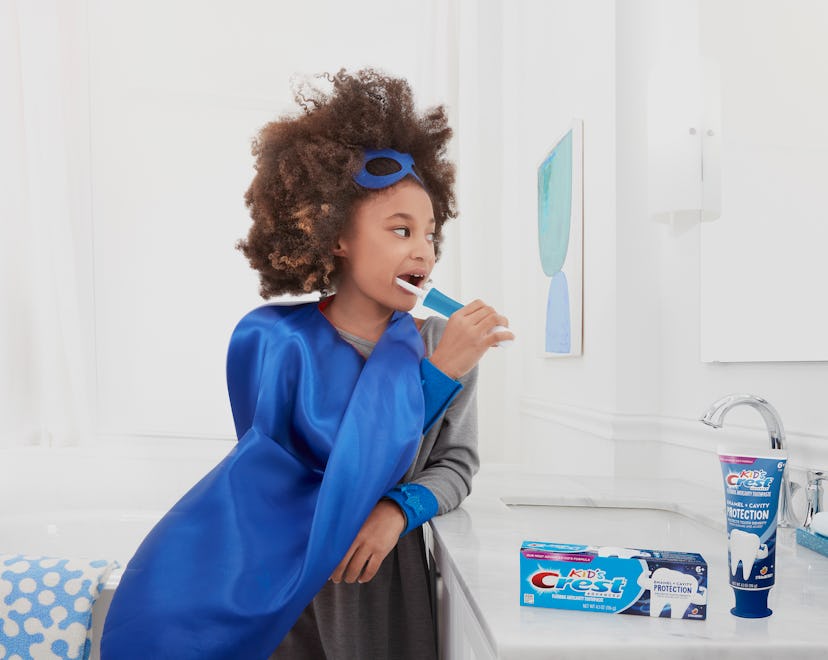 A tired mom washing her teeth