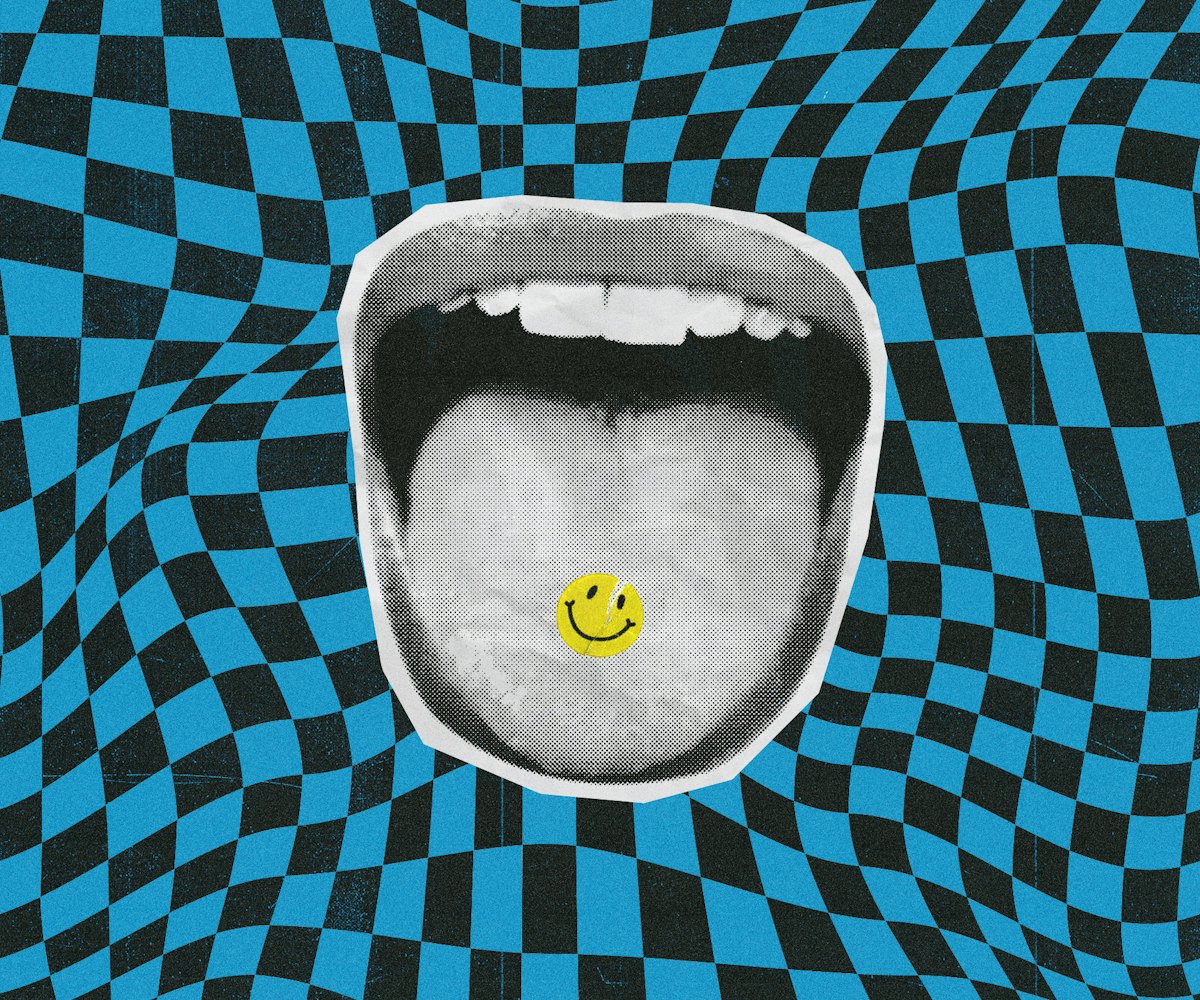 Mouth with a sticked out tongue holding a happy face pill that is supposed to be a psychedelic drug