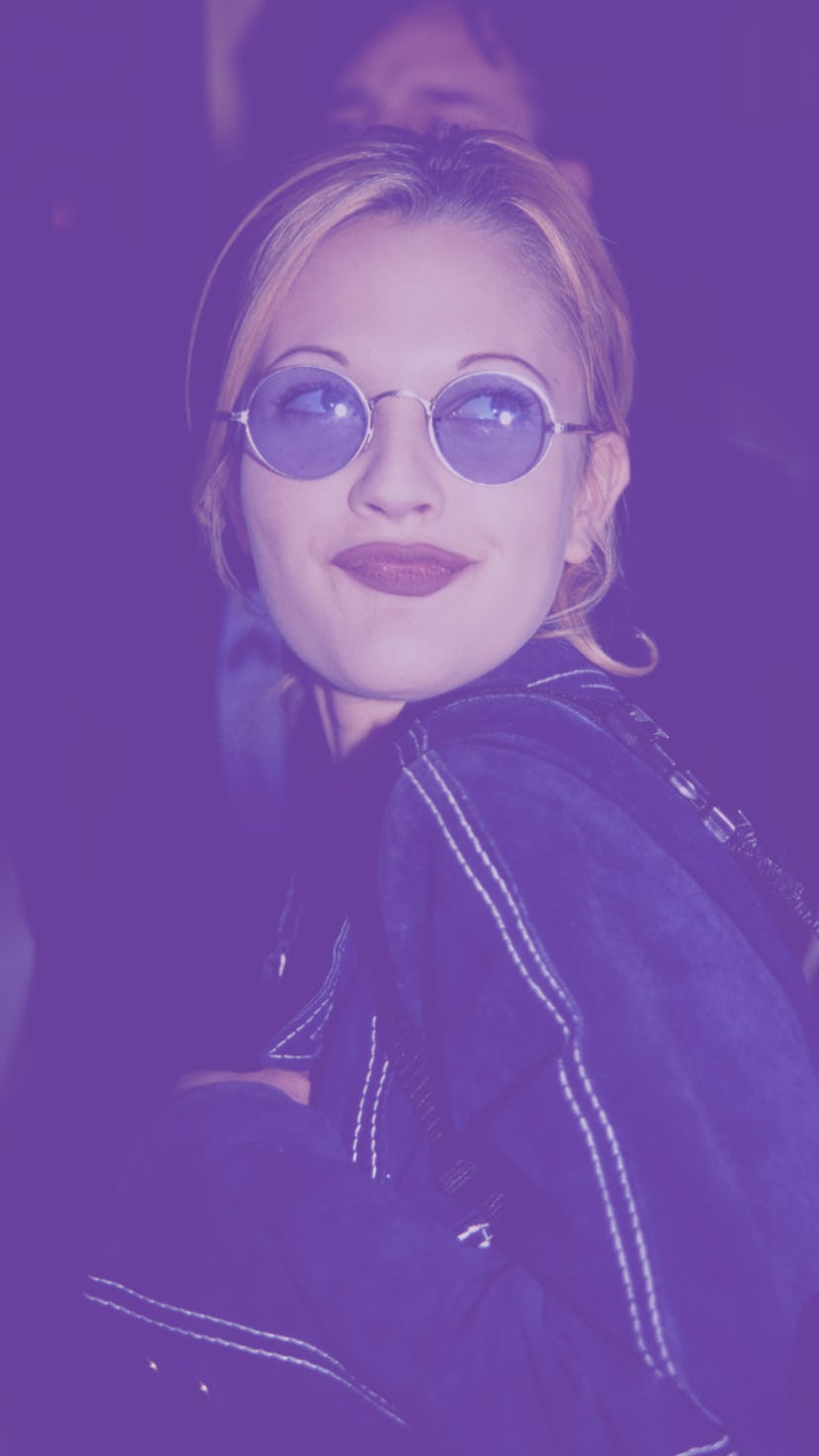 Woman with 90s inspired look at the cover of 90s inspired hairstyles.