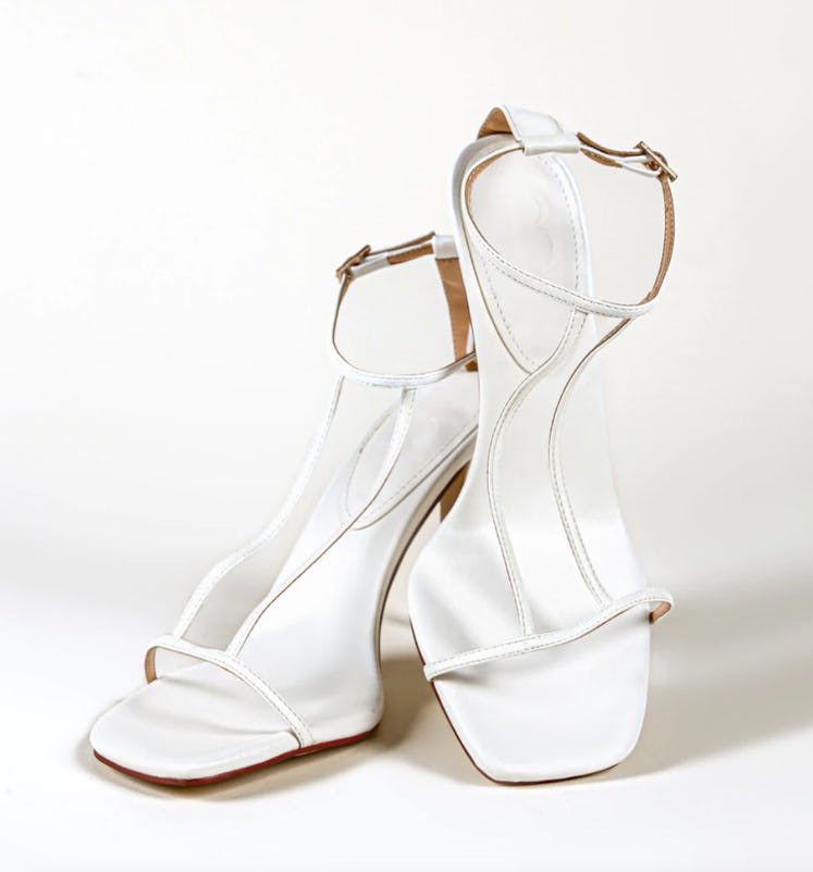 BYDOSE's White T-Strap Detail Shoes. 